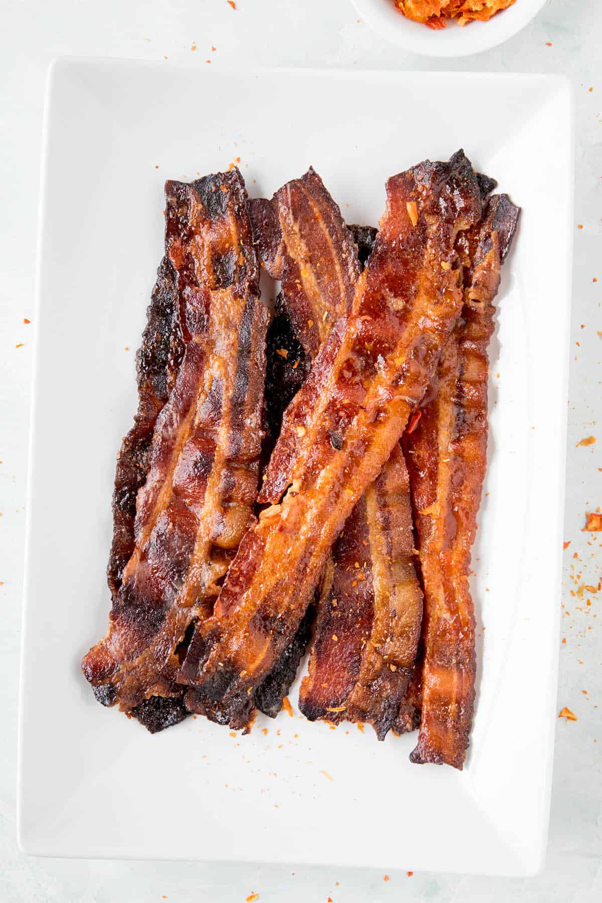 Sweet and Spicy Ghost Pepper Candied Bacon - Recipe Ghost Pepper Candied Bacon - On a plate