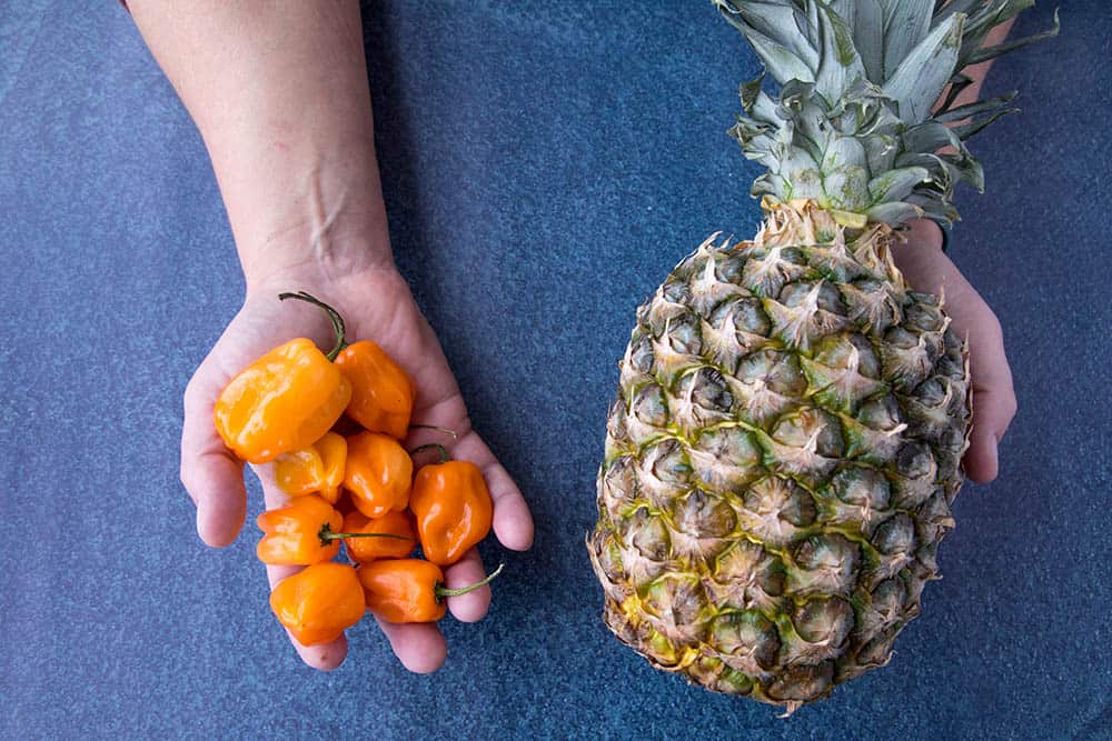 Habanero peppers and a pineapple