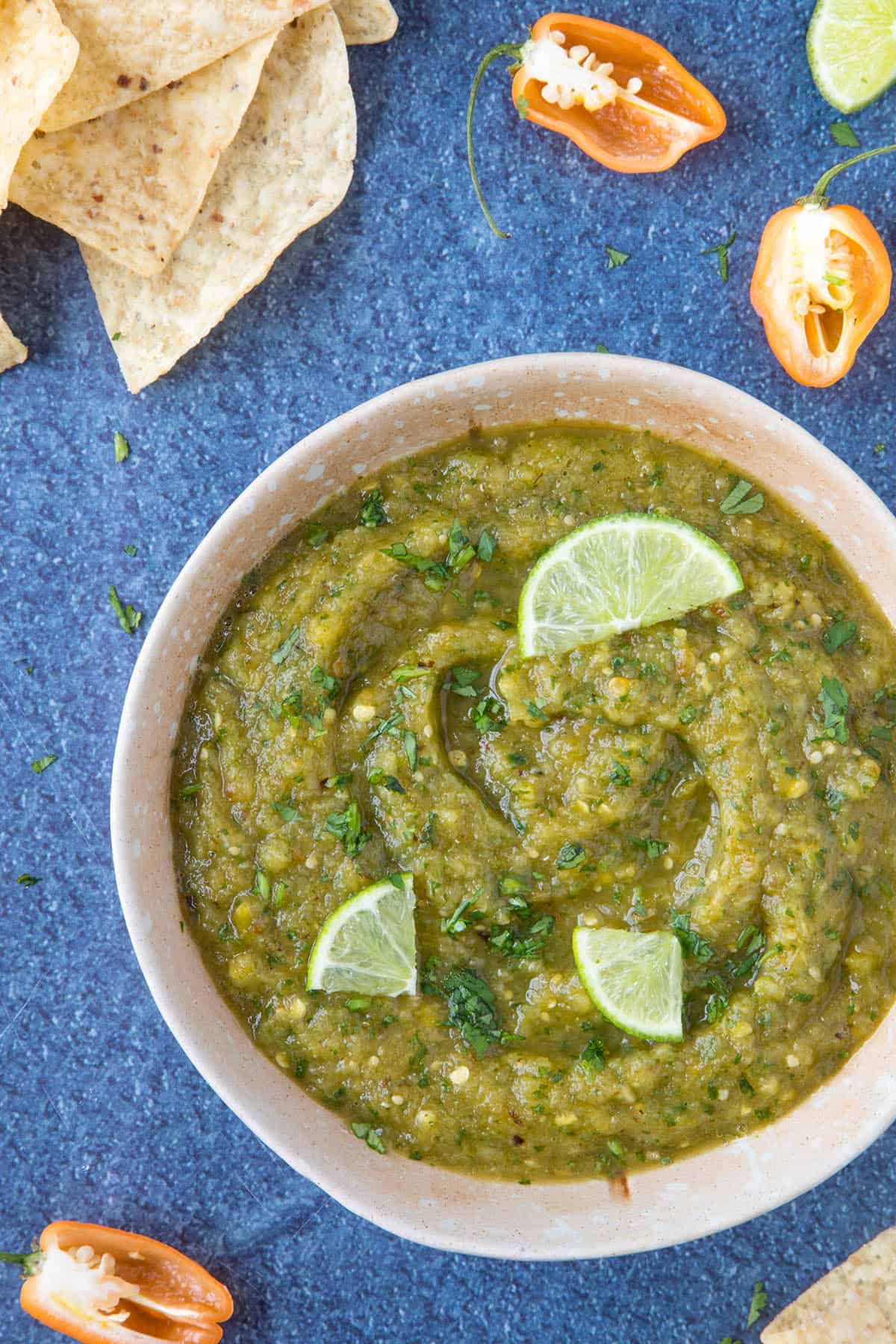 Roasted Pineapple Habanero Salsa - In a bowl with limes, ready to serve