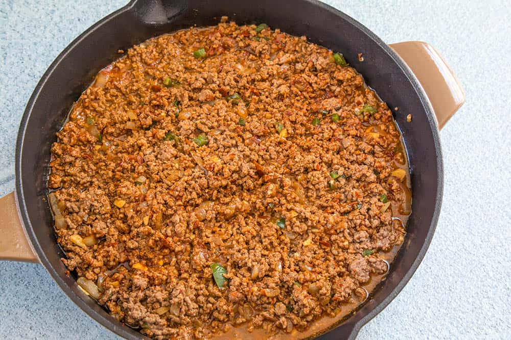 Cooking down the beef for our beef enchiladas