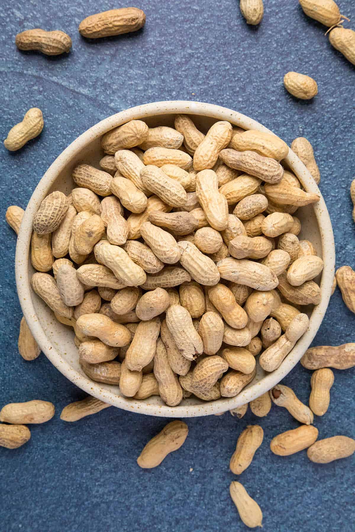 Raw green peanuts in a bowl