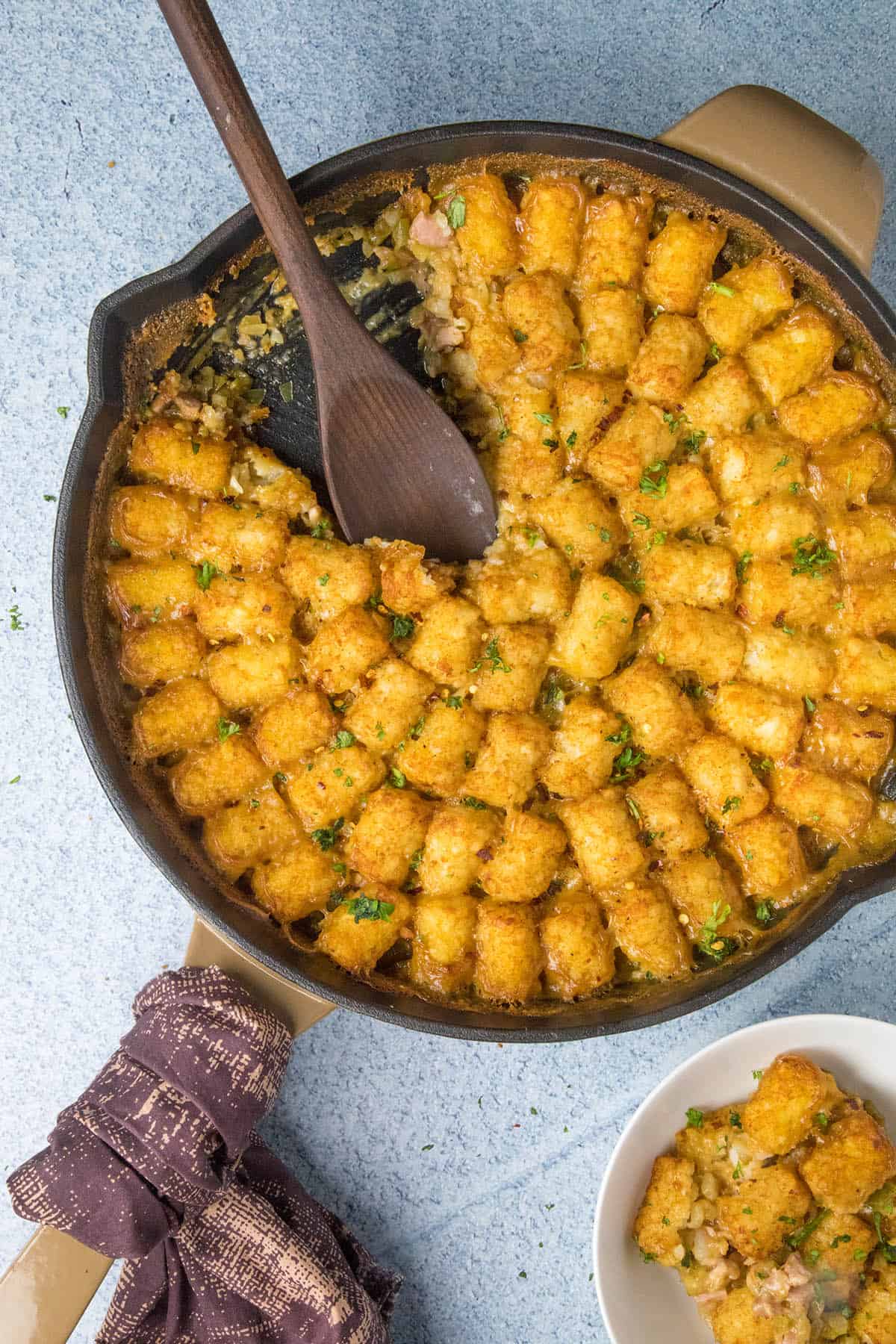 Cajun Ham and Turkey Tater Tot Casserole, with a scoop taken out