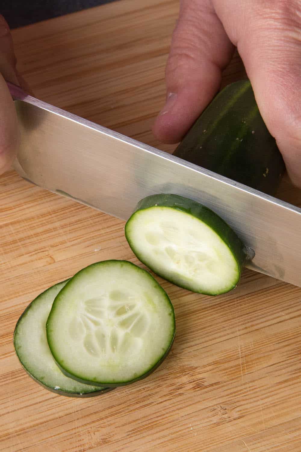 Slicing the cucumbers