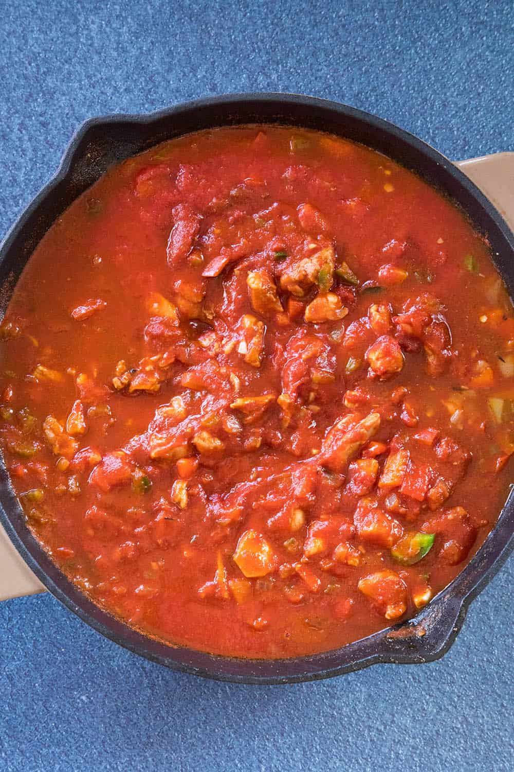 Simmering the Chicken Creole in a pan