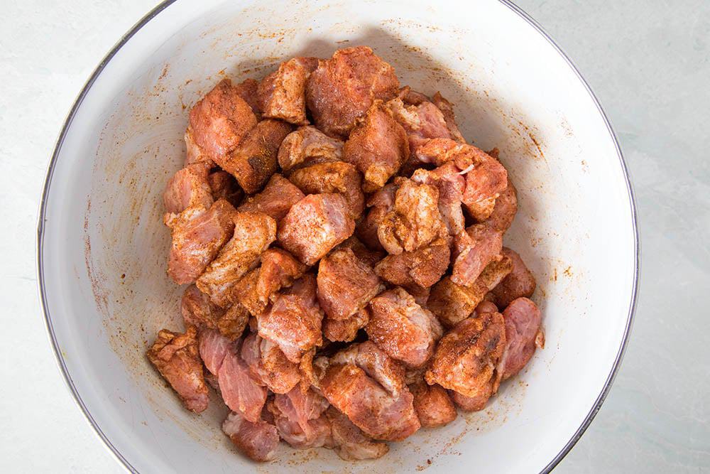 Pork shoulder, cubed and seasoned.