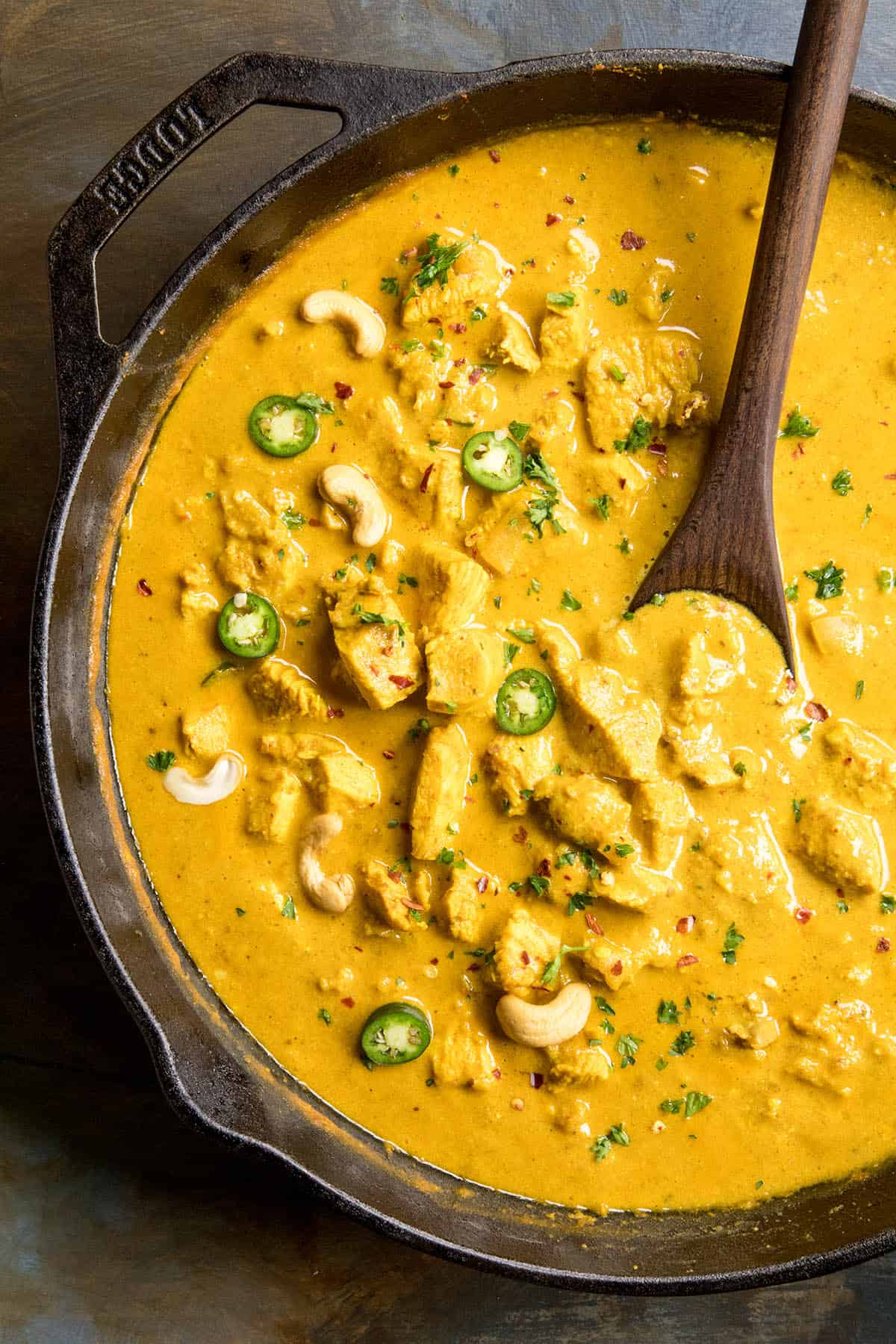Chicken Korma in a pan with garnish