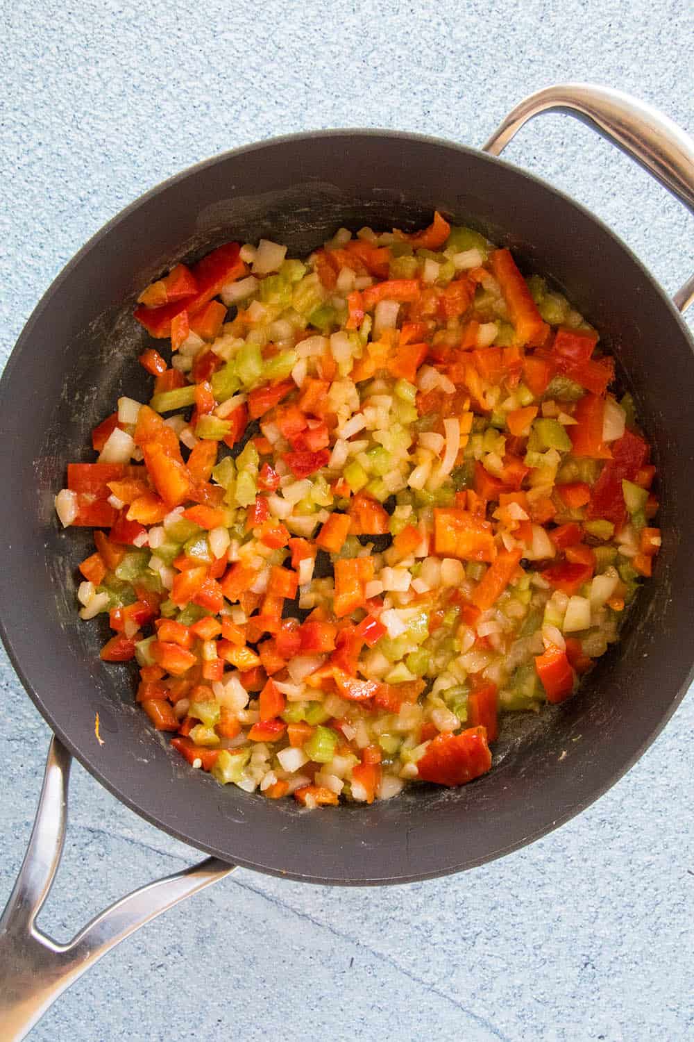 Cooking down the Holy Trinity of onion, bell pepper and celery