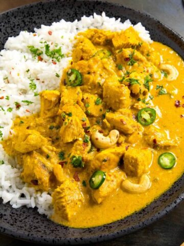 Chicken Korma ready to serve on a plate with garnish