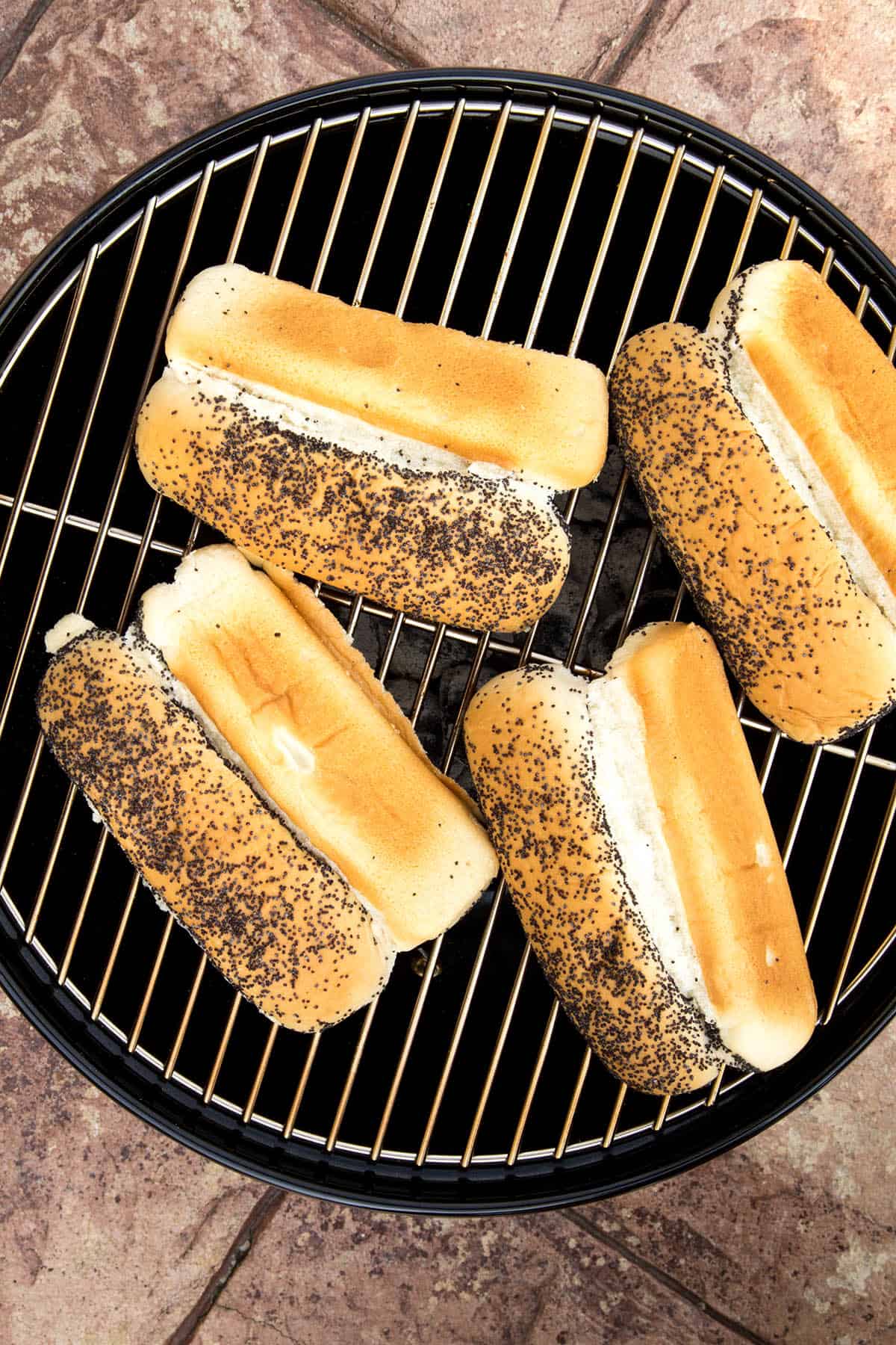 Poppy seed buns on the grill.