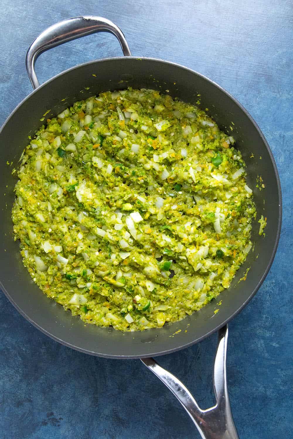 Cooking down the vegetables and sofrito for arroz con pollo