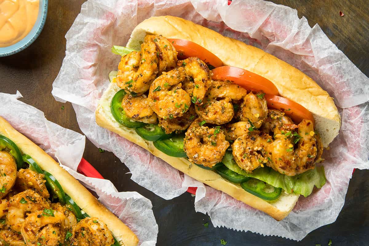 Grilled shrimp po boy sandwich in a basket