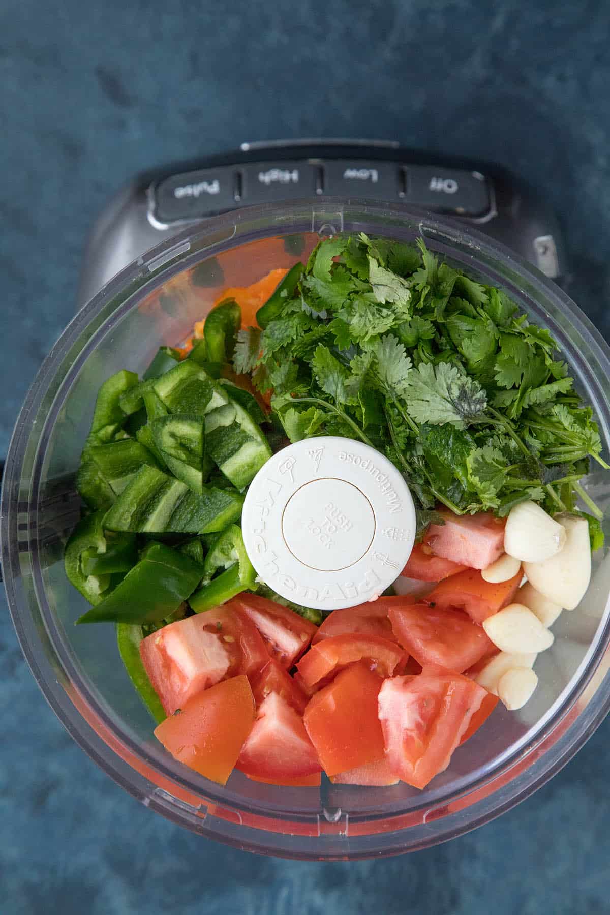 Sofrito ingredients in a food processor