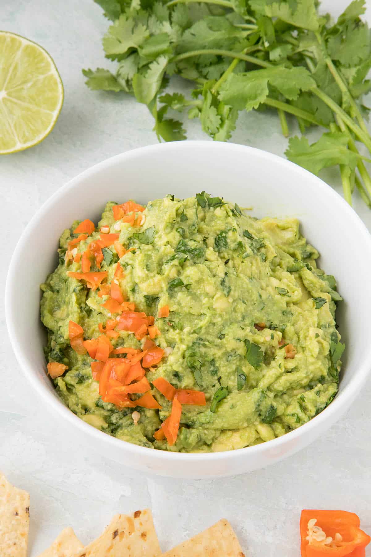 Spicy guacamole with habanero peppers in a bowl