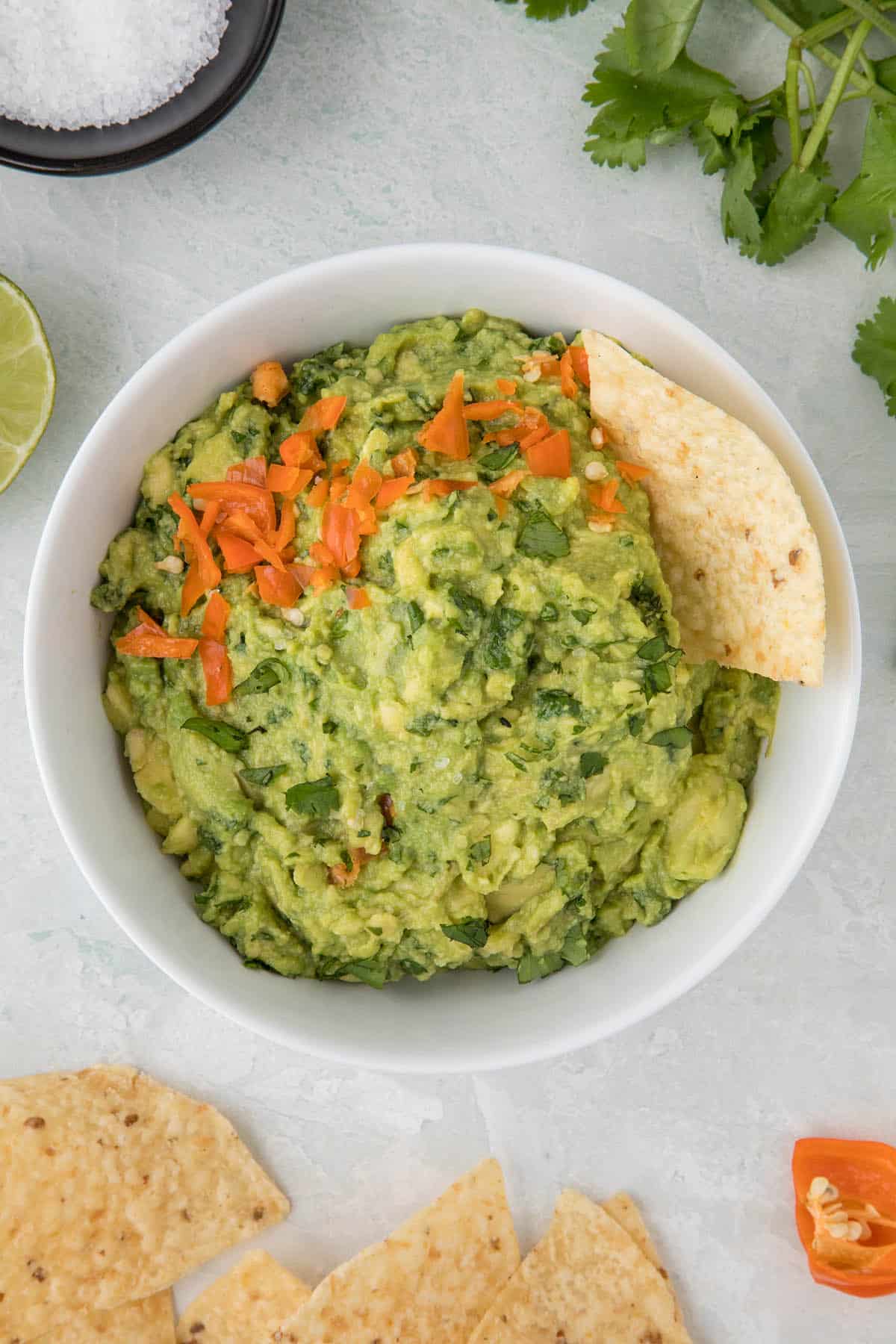 Spicy guacamole with habanero peppers in a bowl, ready to serve