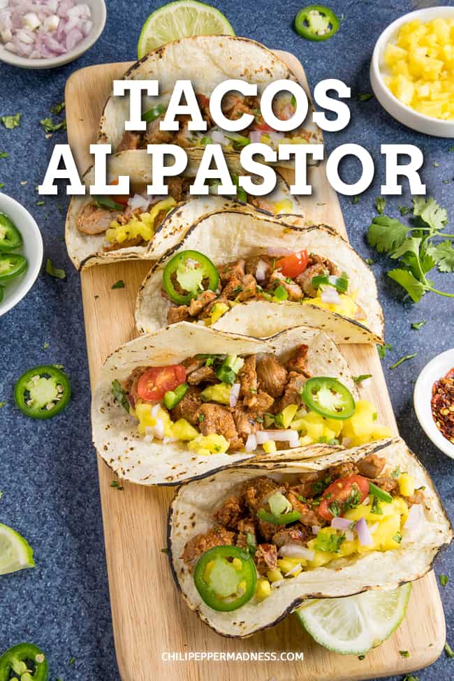 Tacos al Pastor Recipe - The best tacos al pastor recipe takes flavorful pork shoulder seasoned in a zesty marinade and grills it to perfection, just like this one. Get the tortillas ready! #MexicanFood #Tacos