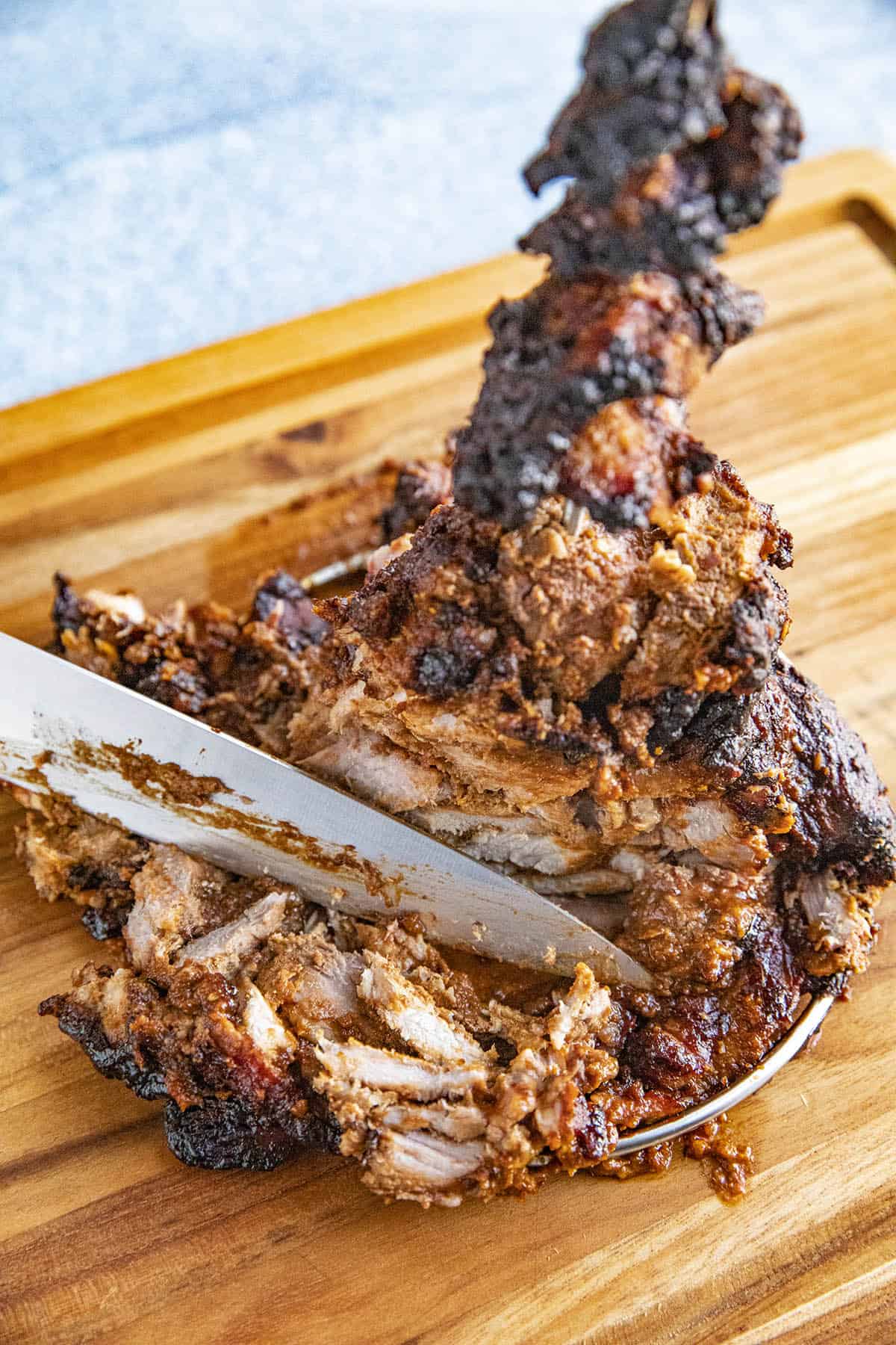 Slicing the pork for tacos al pastor