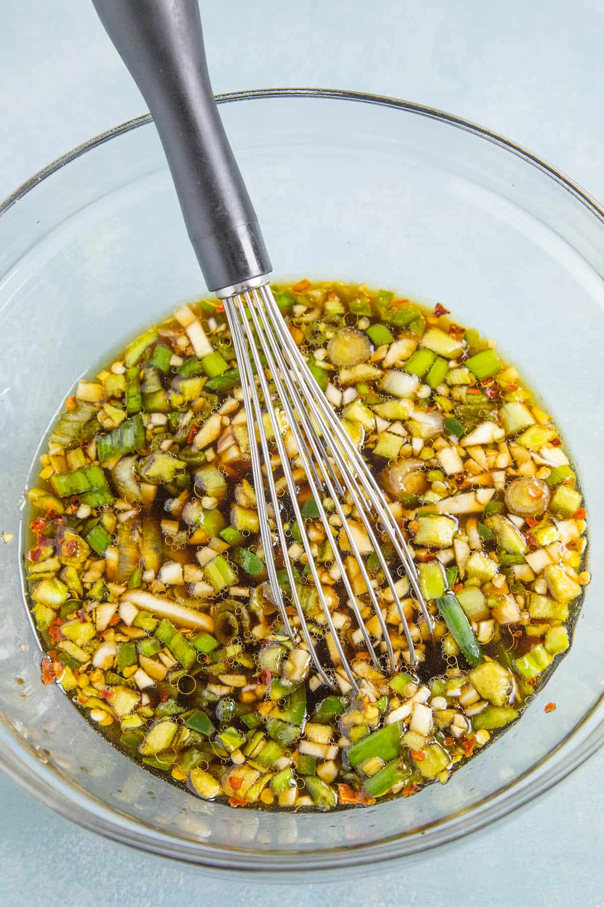 Whisking the Teriyaki Marinade in a bowl