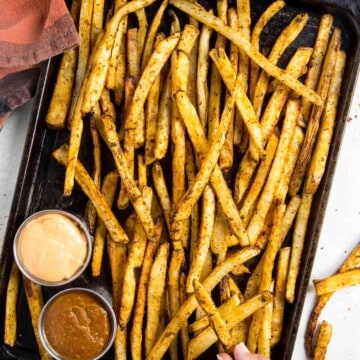 Snatching one of my Baked Cajun Fries off the tray