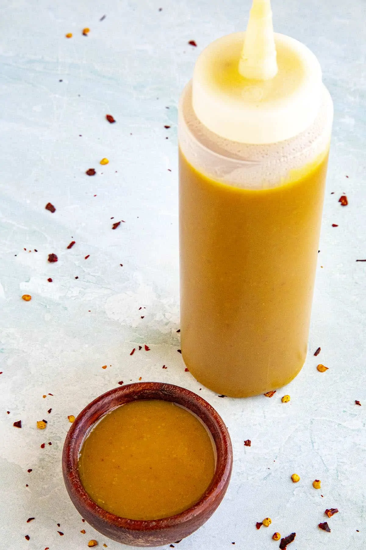 Carolina Mustard BBQ Sauce in a bowl and a squeeze bottle