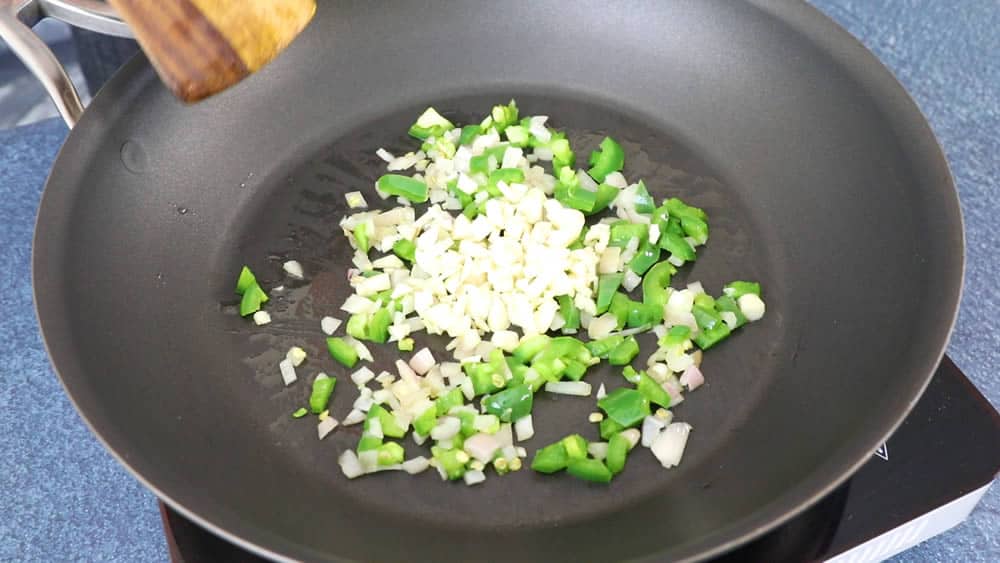 Cooking down the onions, jalapenos and garlic