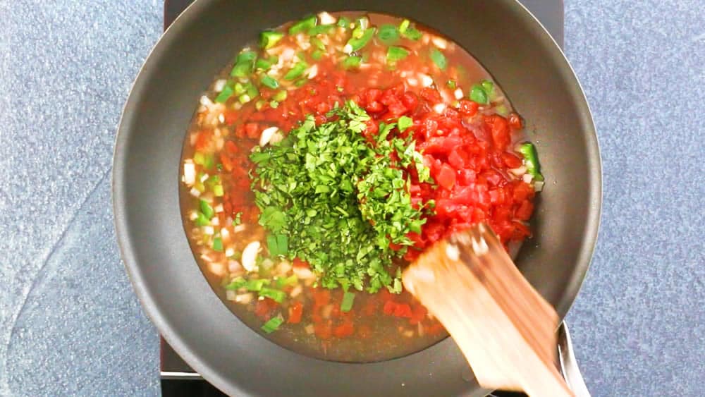 Stir in the cilantro, tomatoes and broth