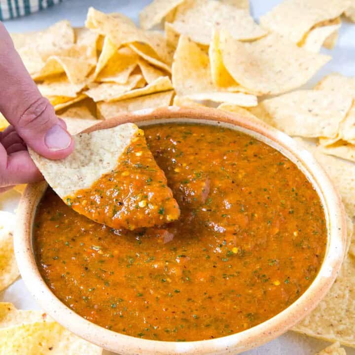 Dipping a chip into the Roasted Mango-Habanero Salsa.