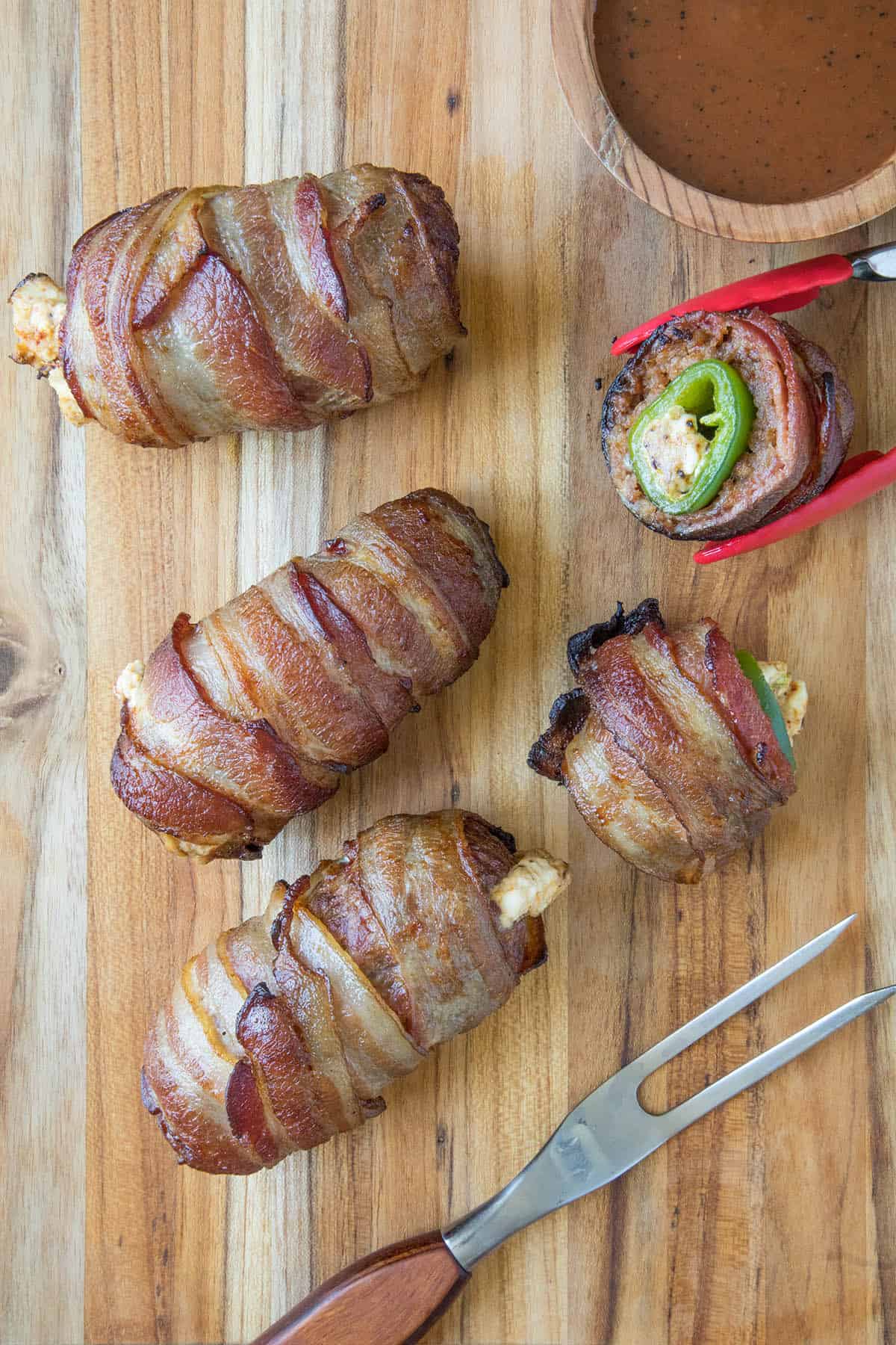 Armadillo Eggs on a cutting board looking incredible