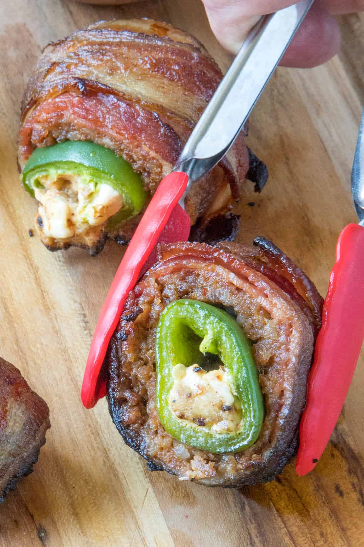 An armadillo egg, sliced open to reveal the jalapeno popper within