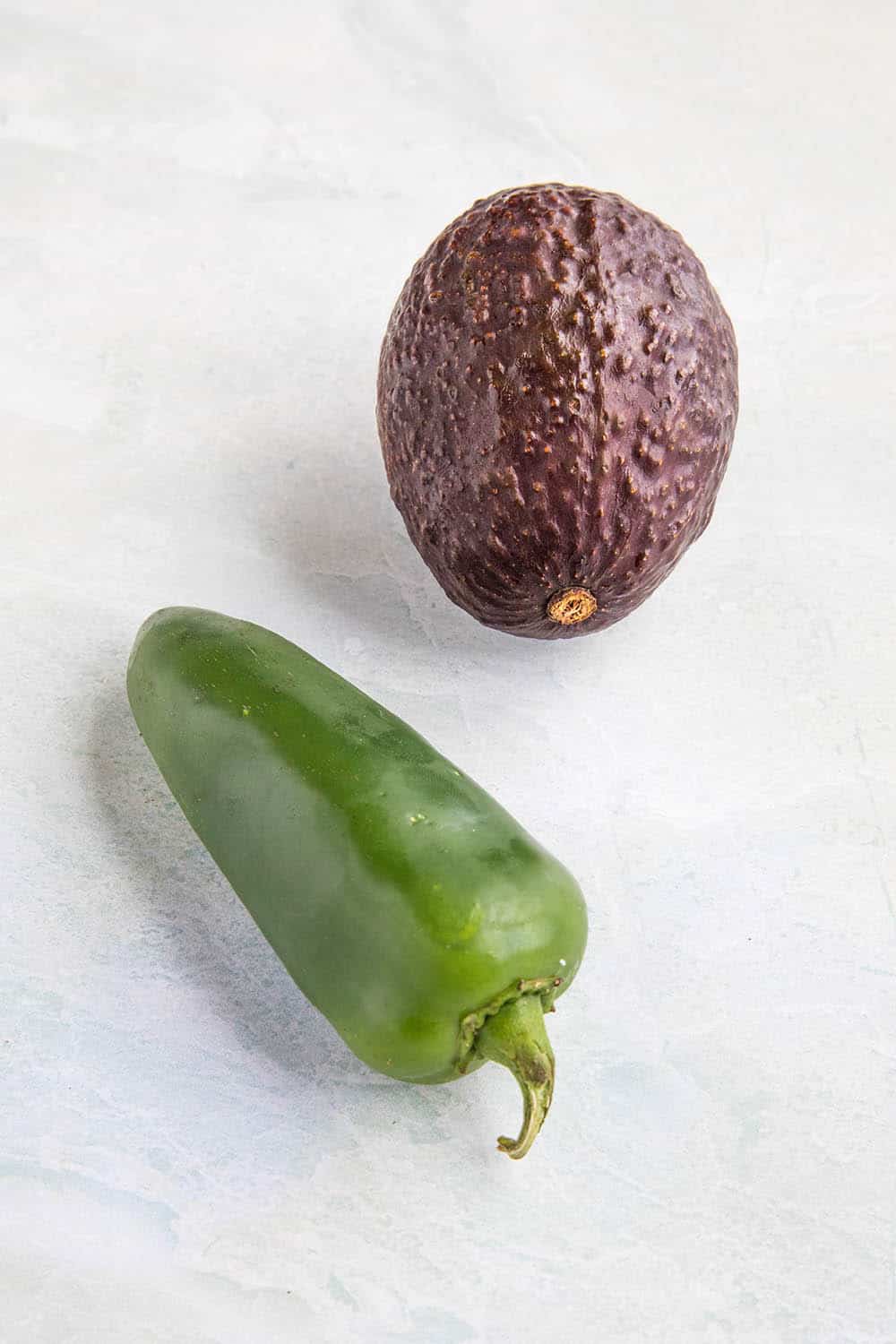 An avocado and a jalapeno pepper, best friends