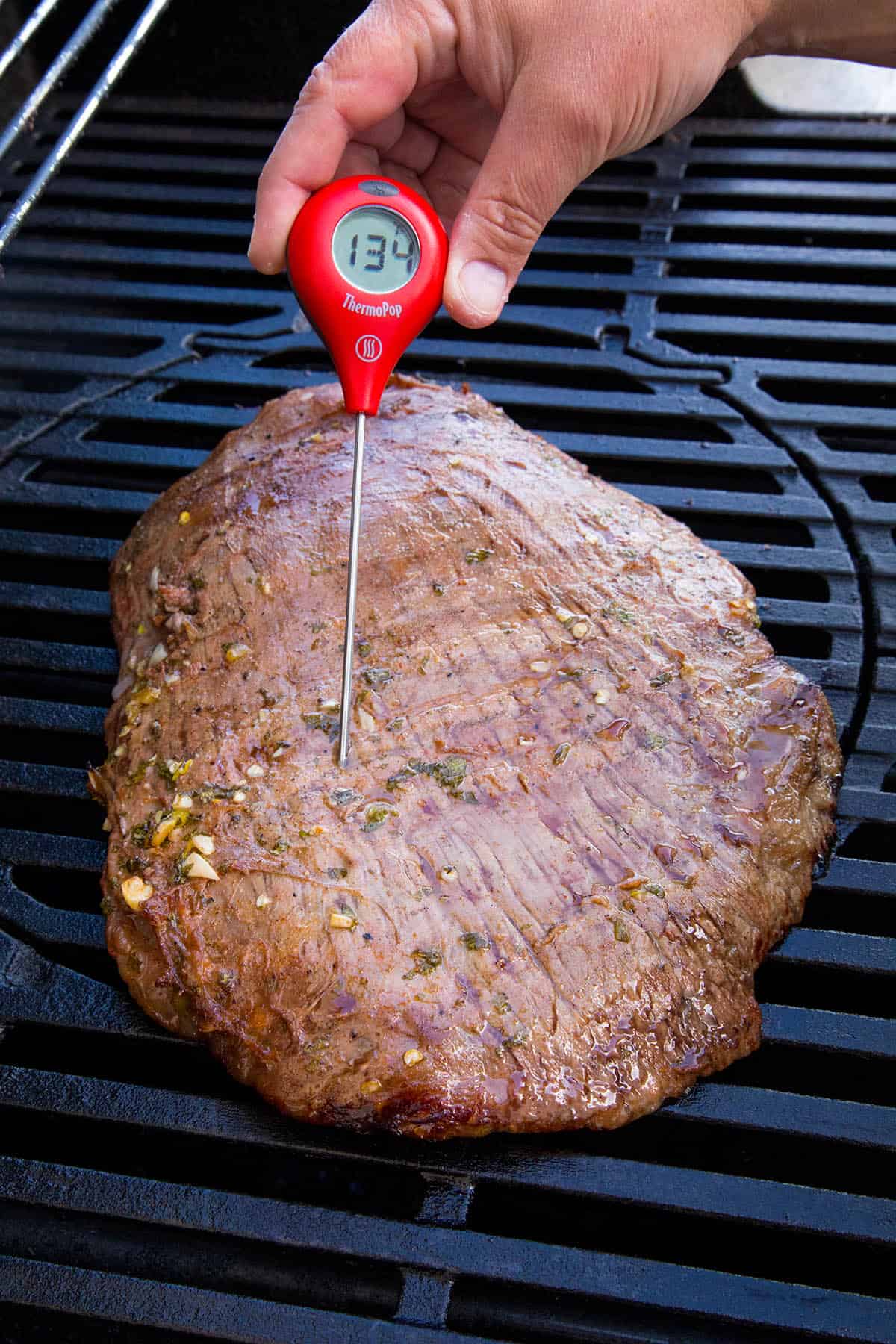 Checking the internal temperature of my flank steak