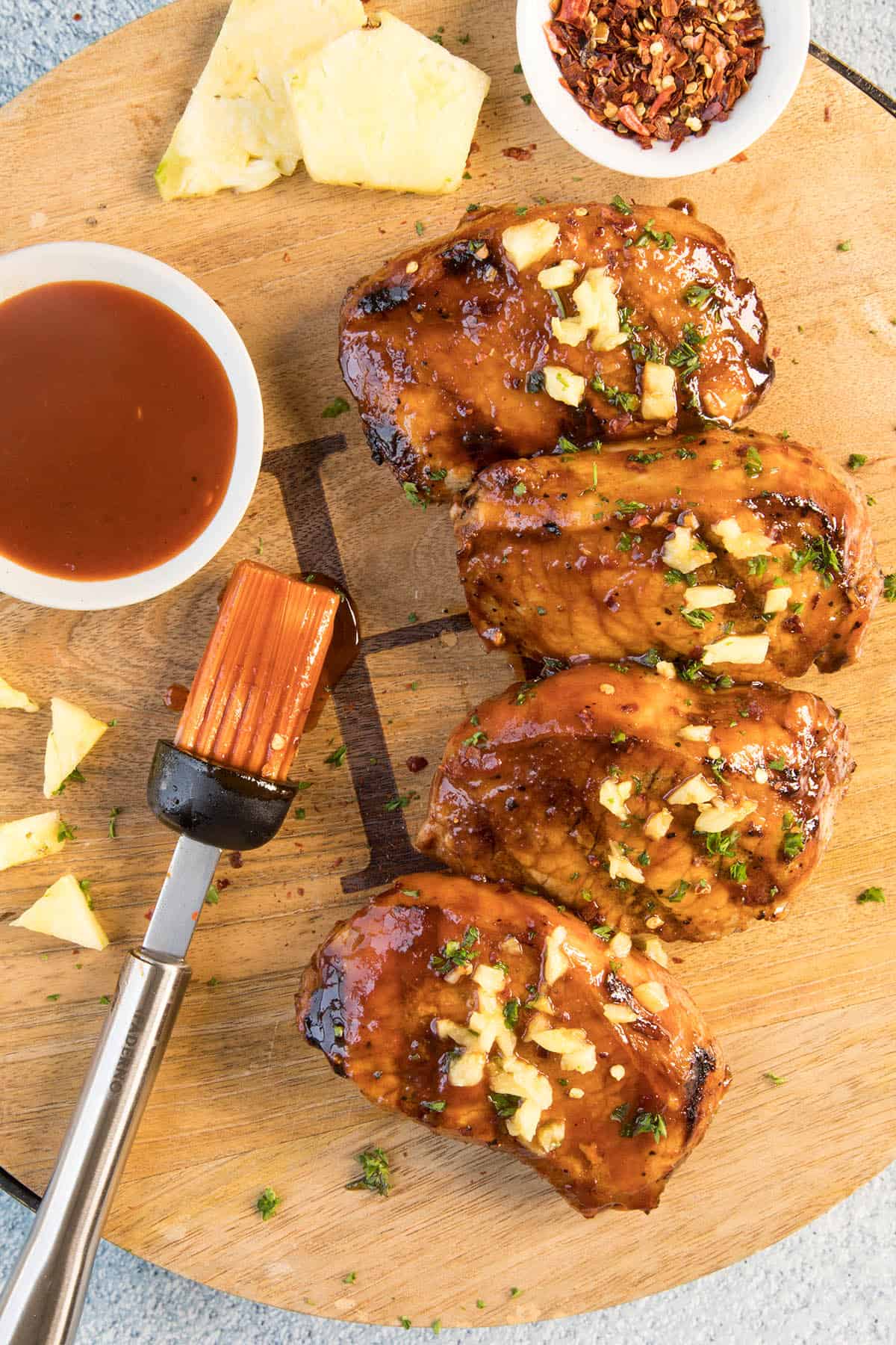 Grilled Pork Chops with Pineapple-Gochujang Glaze on a platter, ready to serve