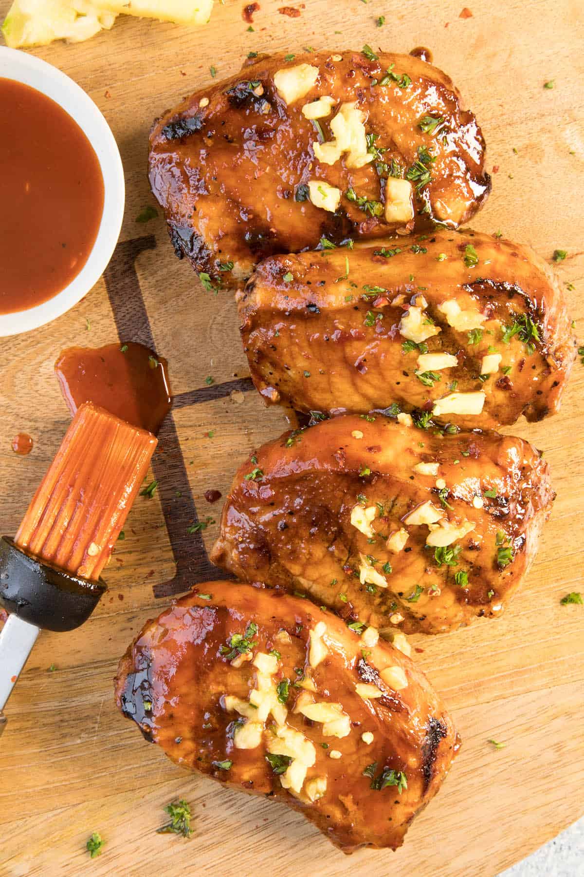 Grilled Pork Chops with Pineapple-Gochujang Glaze on a platter