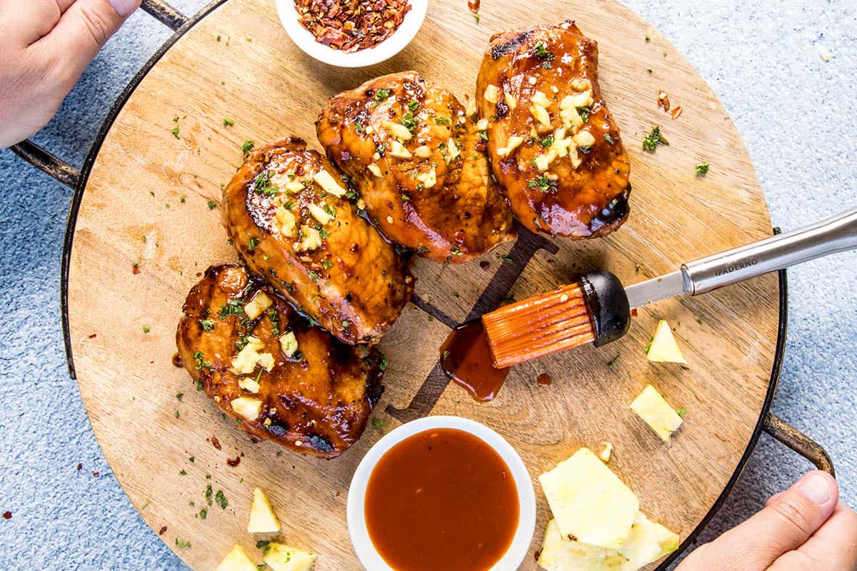 Serving up the Grilled Pork Chops with Pineapple-Gochujang Glaze