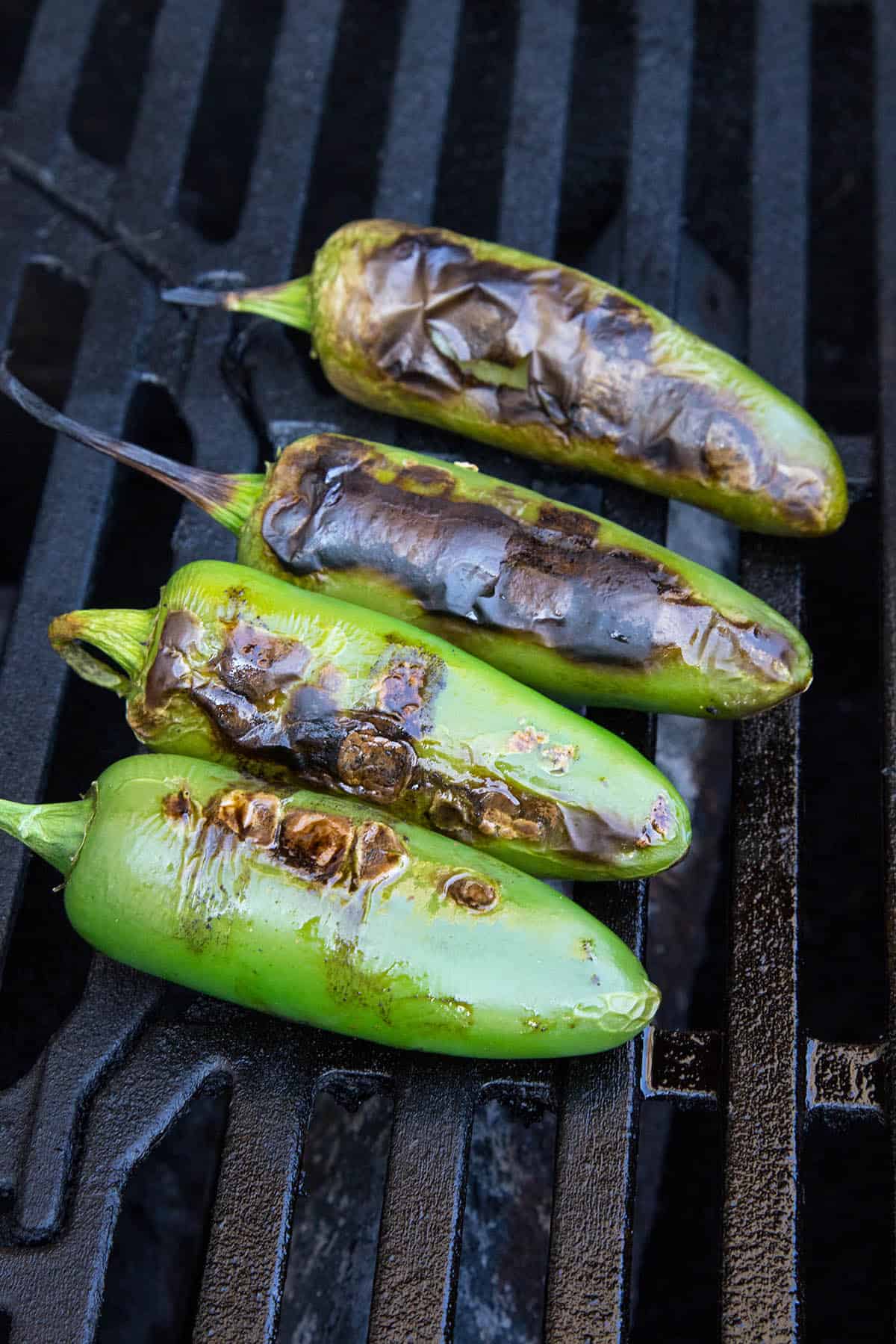 Grilling jalapeno peppers on the grill