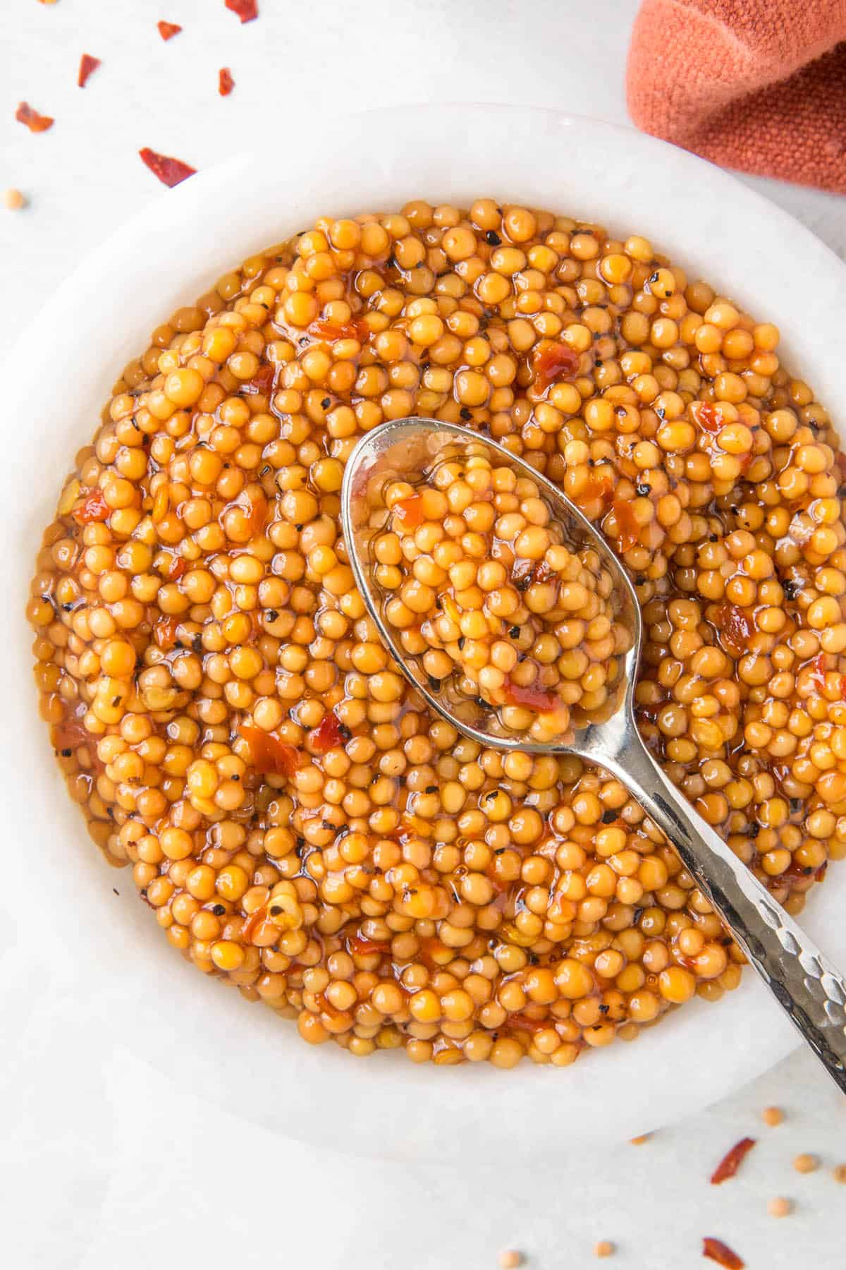 A spoonful of the pickled mustard seeds