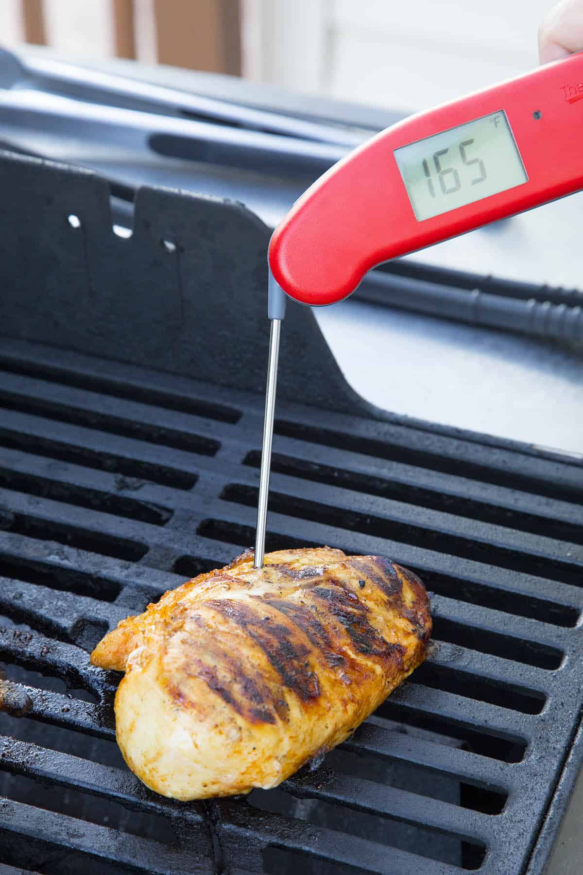 Testing the internal temperature of my grilled chicken