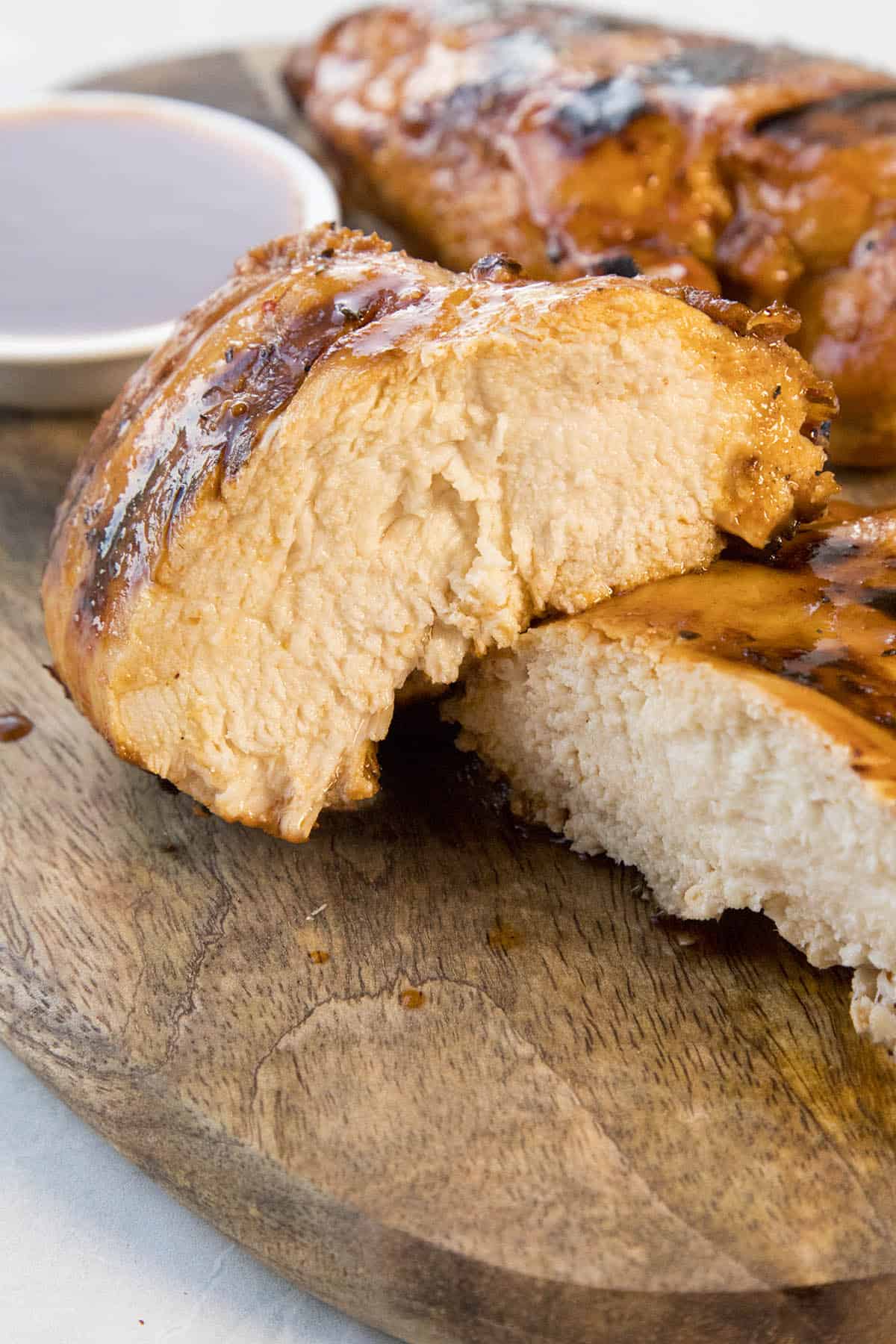 Juicy Honey Sriracha Chicken sliced in half