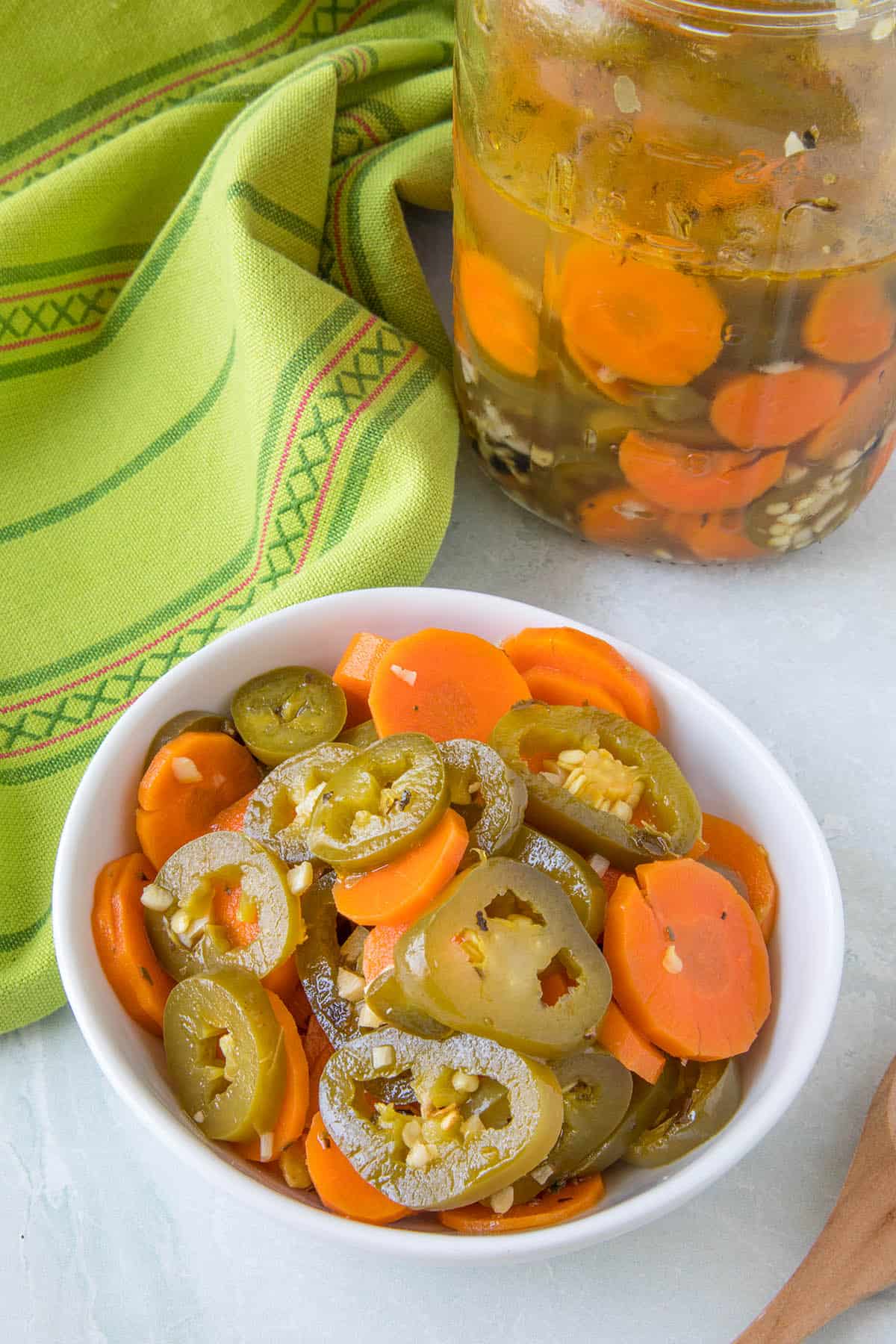 Pickled jalapeno peppers and carrots in a bowl