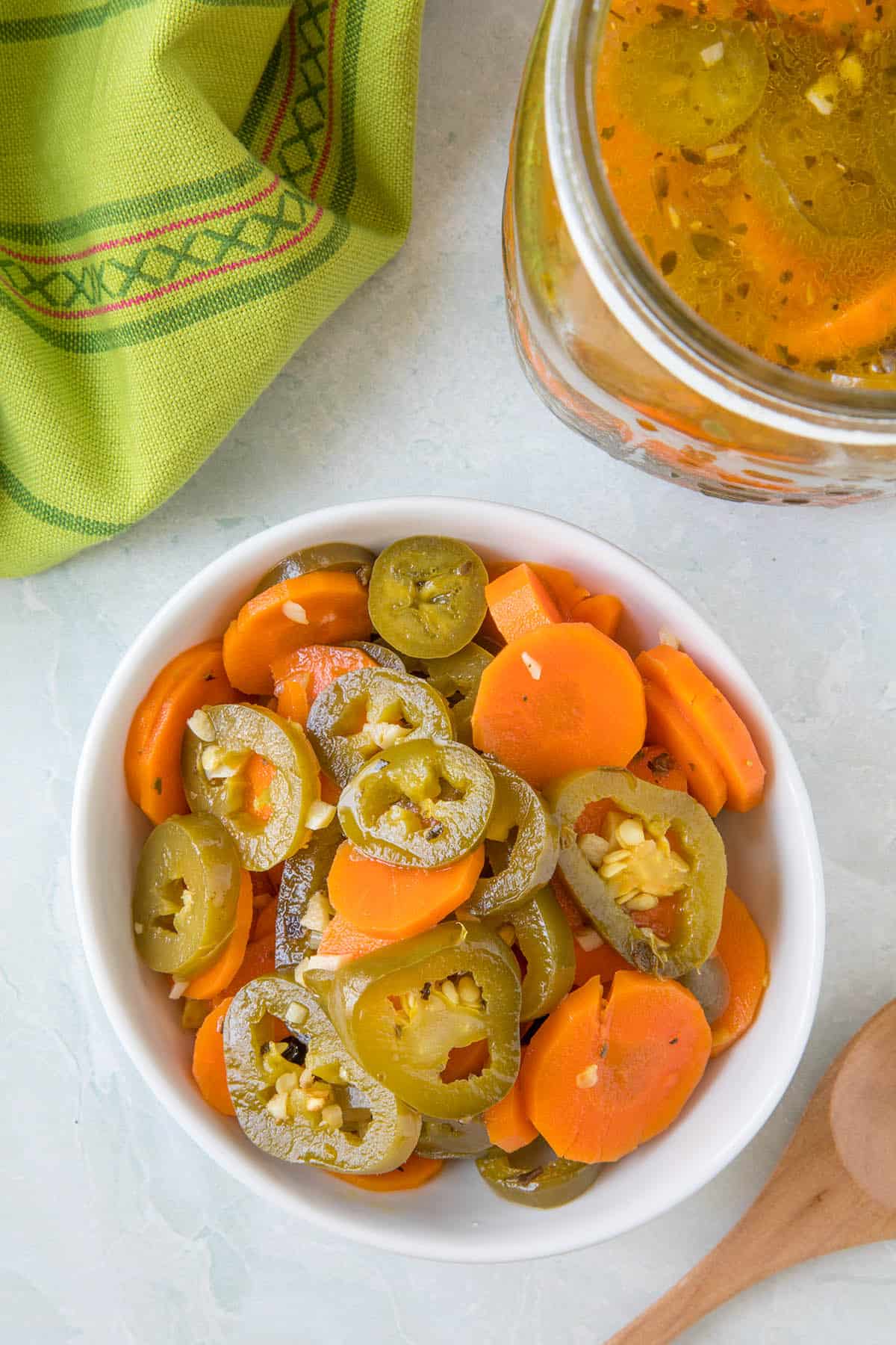 Pickled jalapenos and carrots in a bowl, ready to serve