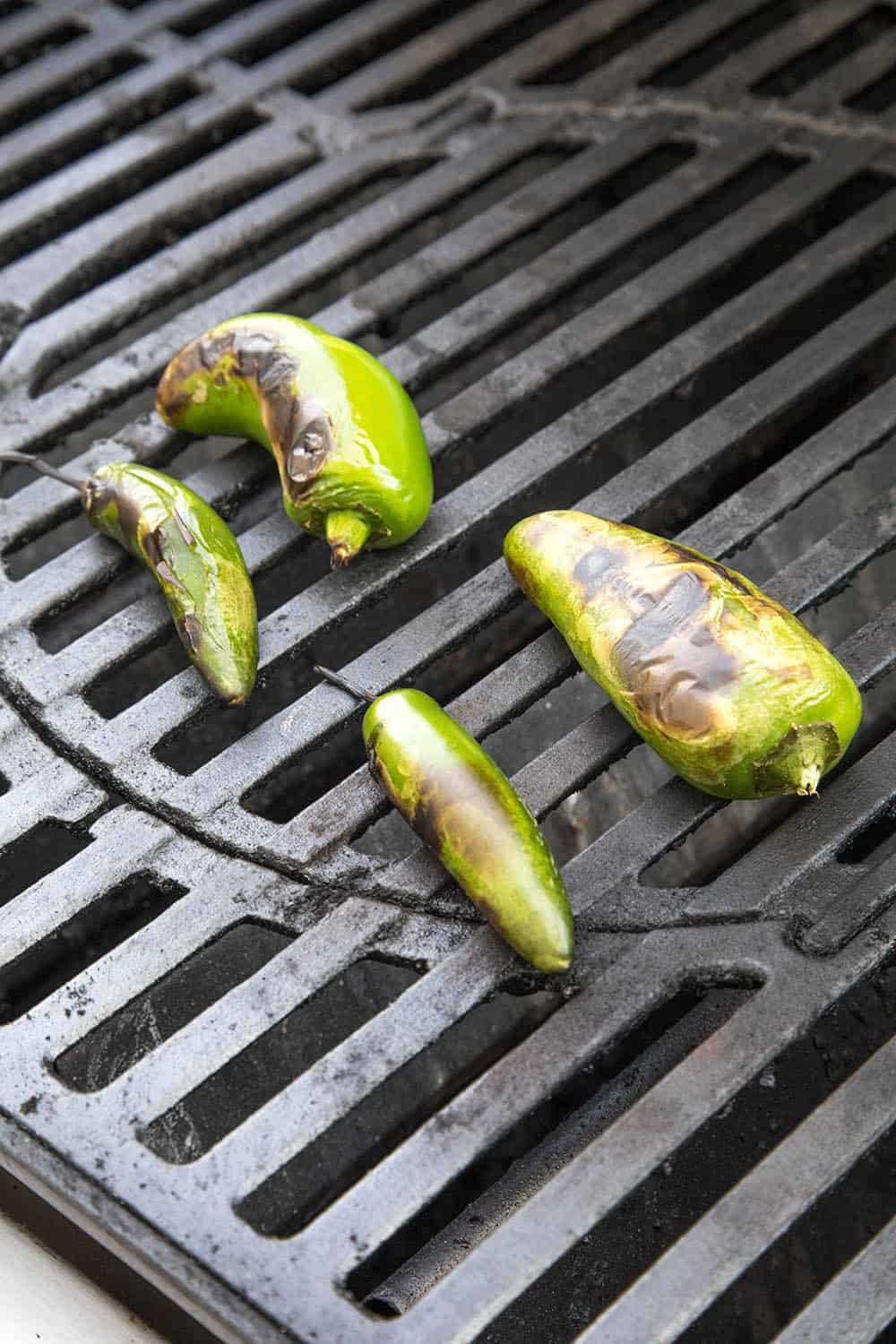 Roasting peppers to top our Juicy Lucy burgers