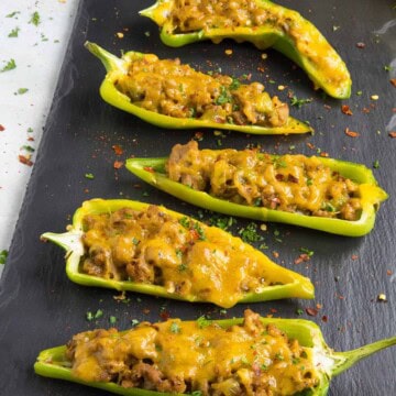 Turkey and Cheddar Stuffed Anaheim Peppers served on a board