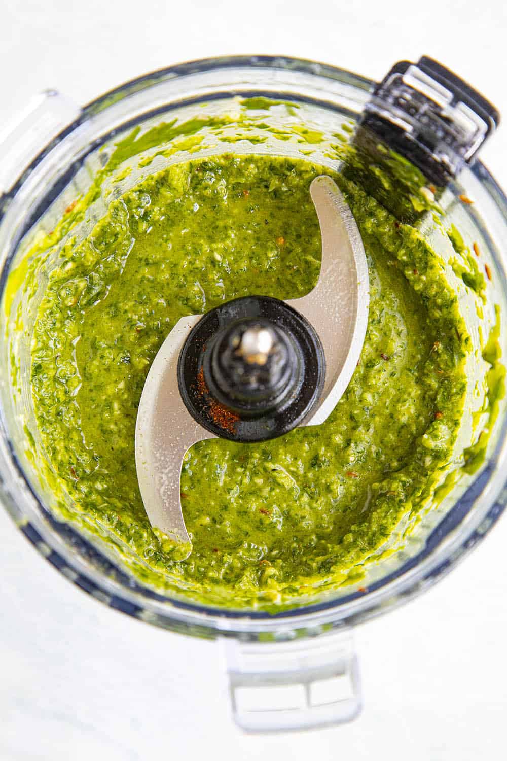 Green Harissa in a food processor, processed