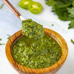 Green Harissa served in a wooden bowl