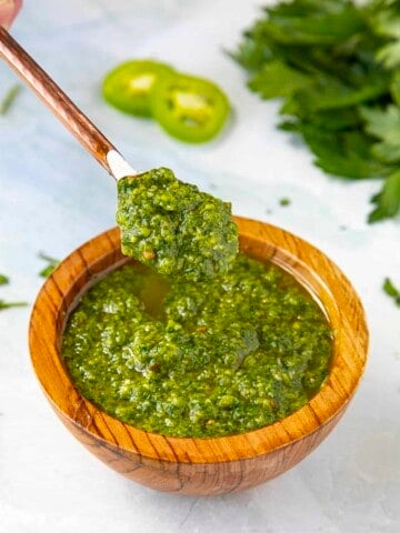 Green Harissa served in a wooden bowl