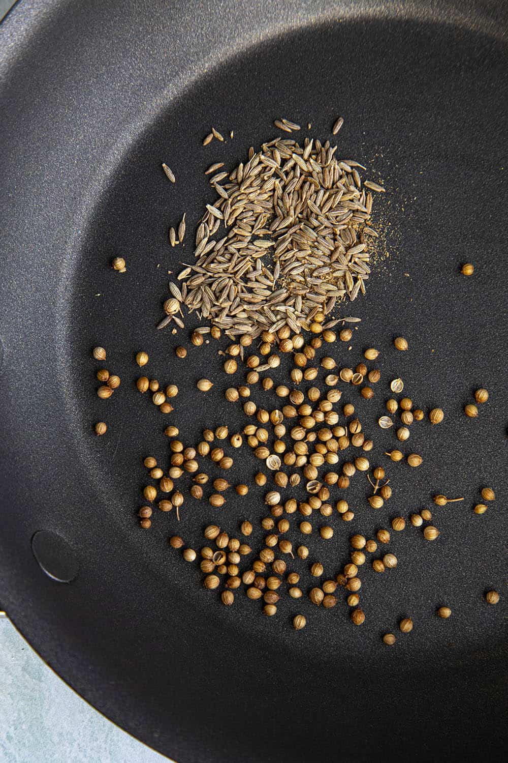 Toasting seeds to make green harissa