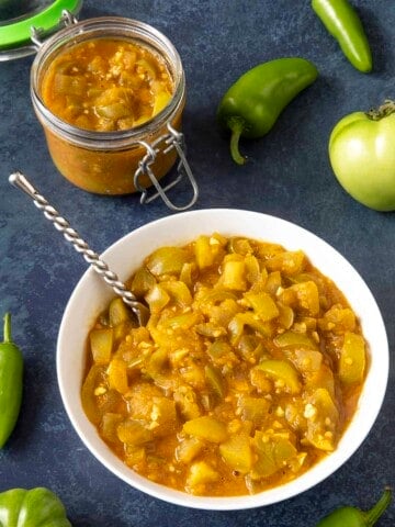 Green Tomato Chutney served in a jar and a bowl