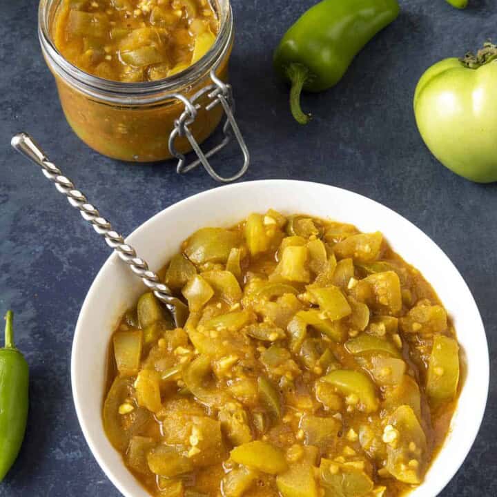 Green Tomato Chutney served in a jar and a bowl