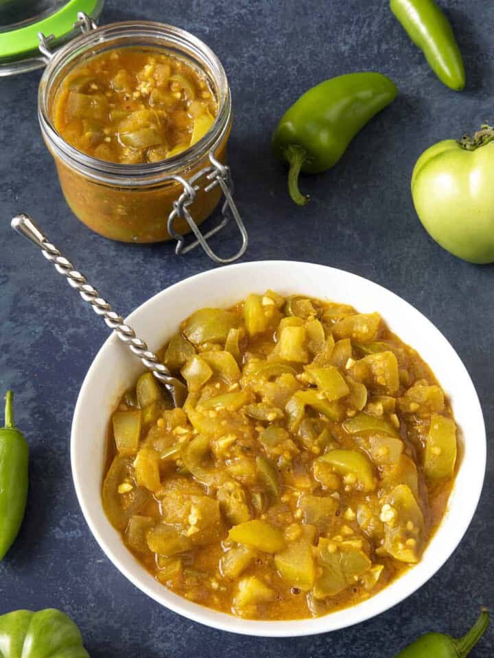 Green Tomato Chutney served in a jar and a bowl