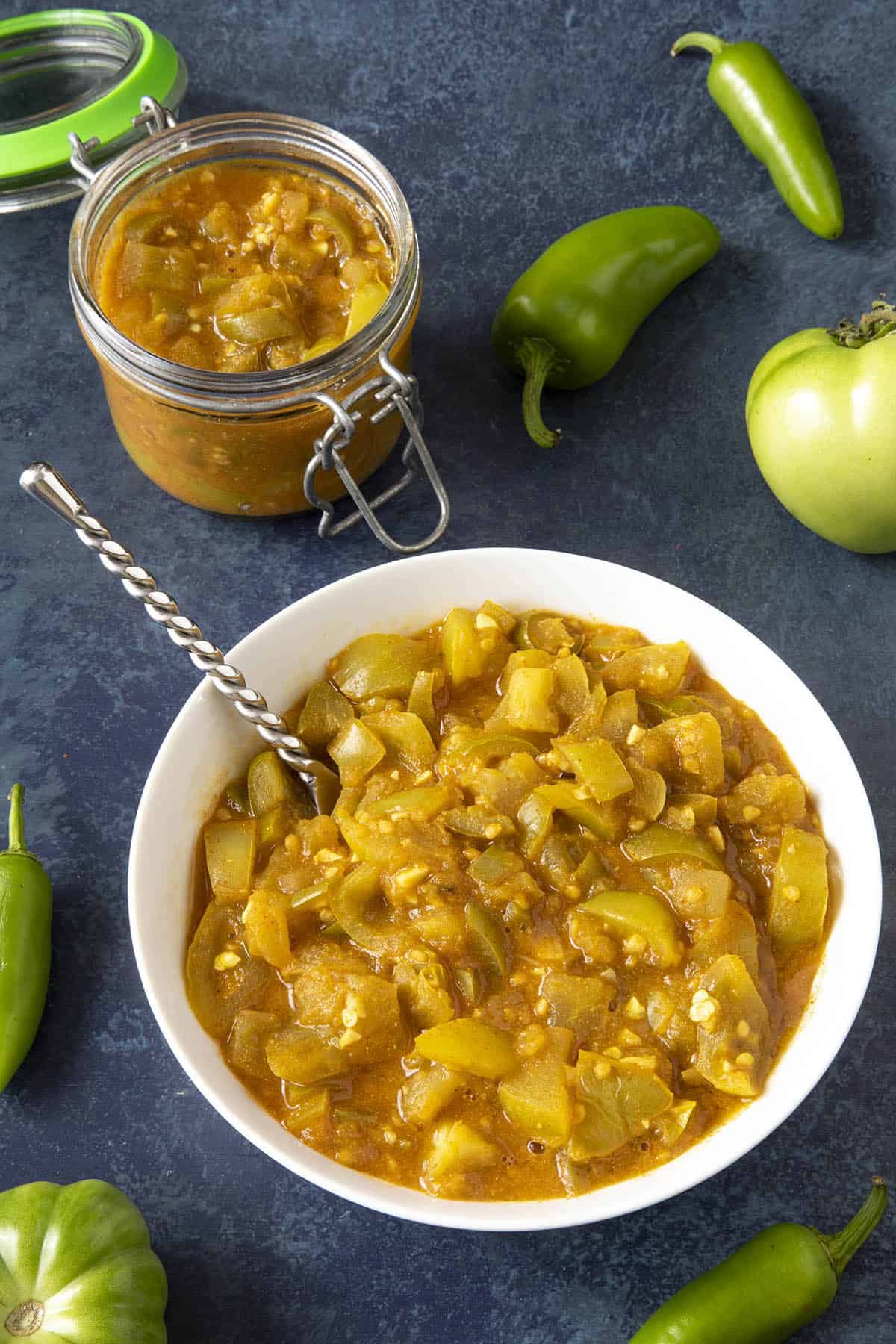 Green Tomato Chutney served in a jar and a bowl