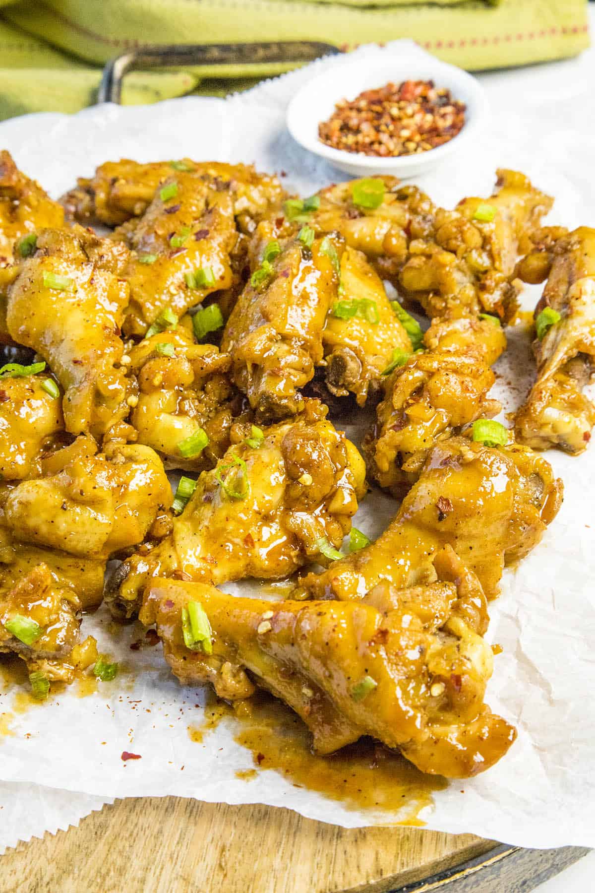 Sticky Chicken Wings on a platter, glistening with sticky sauce.